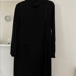 N.y MAGAZINE size 38 black tunic with cut out in front.